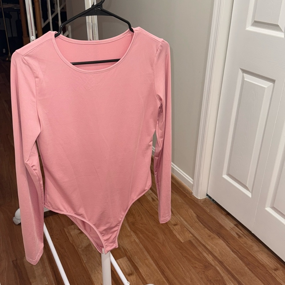 New without tag long sleeve women rose pink bodysuit.